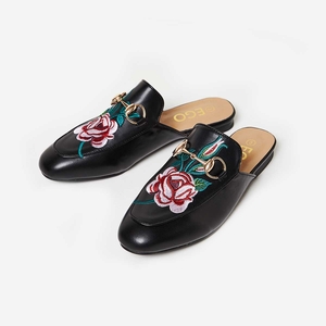 Cheska Floral Embroidered Flat Mule In Black Faux Leather