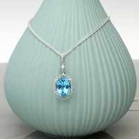 Oval Blue Topaz Pendant Set In 9ct White Gold & Diamonds With Optional Chain