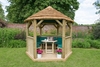 Forest Garden 3m Hexagonal Wooden Garden Gazebo with Thatched Roof - Furnished with Table,  Benches and Cushions (Green)