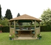 Forest Garden 4.7m Hexagonal Wooden Garden Gazebo with Thatched Roof - Furnished with Table,  Benches and Cushions (Green)