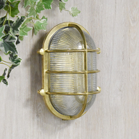 Edit Coastal Bow Outdoor Flush Wall Light - Brass