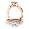 A striking princess cut diamond ring with shoulder stones in 18ct rose gold