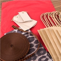 Jane Means Red and Leopard Tissue Paper with Brown Bags Raffia and Tags