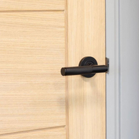 Matt Black Brompton Lever Door Handle on Round Rose Set - Sprung