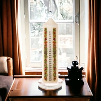 Ivory Pillar Advent Candle on Glass Plate with Festive Decorations