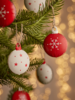 Eight Red & White Metal Baubles