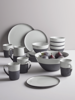 Four Monochrome Stoneware Mugs